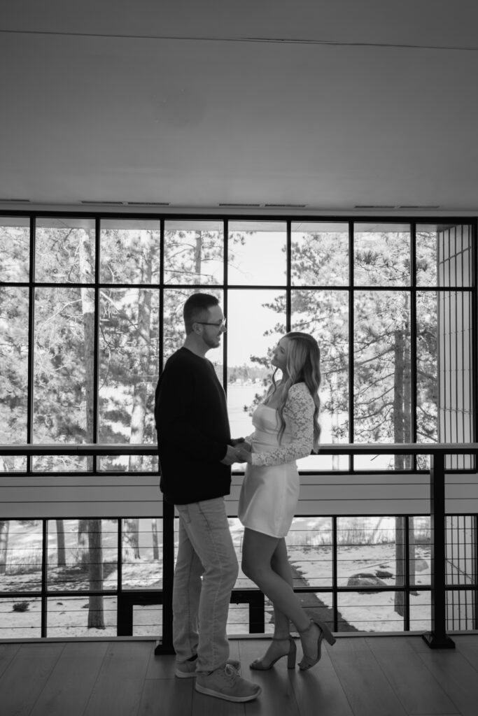 Couple romantically locking eyes inside their wedding venue in Nisswa, MN
